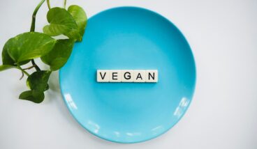 Vegan scrabble on a blue plate