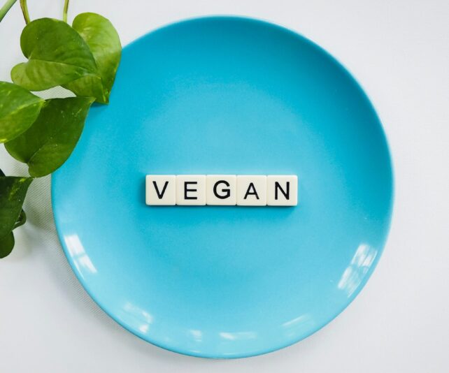 Vegan scrabble on a blue plate